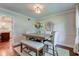 This dining room includes seating for six and a large window at 11510 Ralston Ave, Carmel, IN 46032