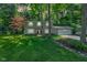 Charming two-story home with attached two-car garage and a lush green front yard at 11510 Ralston Ave, Carmel, IN 46032