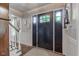 Welcoming foyer features a striking front door with sidelights and hardwood floors at 11510 Ralston Ave, Carmel, IN 46032