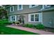 Inviting home entrance with decorative plantings, stylish door, and green lawn at 11510 Ralston Ave, Carmel, IN 46032