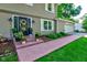 Charming home entrance with a brick walkway, fresh landscaping, and a well-decorated front door at 11510 Ralston Ave, Carmel, IN 46032