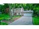 Charming two-story home with manicured lawn, complemented by a paved driveway and lush landscaping at 11510 Ralston Ave, Carmel, IN 46032