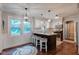 Bright and modern kitchen with barstool seating at the breakfast bar and natural light at 11510 Ralston Ave, Carmel, IN 46032