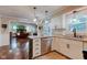 Open kitchen with stainless steel appliances, island seating, and easy access to the living room at 11510 Ralston Ave, Carmel, IN 46032