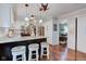 Bright kitchen featuring granite countertops, modern appliances, and a convenient breakfast bar at 11510 Ralston Ave, Carmel, IN 46032
