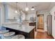Well-lit kitchen featuring white cabinets, granite counters, and stainless steel appliances at 11510 Ralston Ave, Carmel, IN 46032