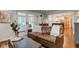 Inviting living room featuring a comfortable leather sofa and a view of the outdoor patio at 11510 Ralston Ave, Carmel, IN 46032
