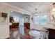 Open layout shows living room with fireplace and kitchen with bar seating, seamlessly connected at 11510 Ralston Ave, Carmel, IN 46032