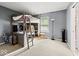 Unique bedroom featuring a built-in loft bed, desk space, and ample natural light at 11987 Quarry Ct, Fishers, IN 46037