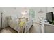 Charming bedroom with soft lighting, floral comforter, and cozy atmosphere at 11987 Quarry Ct, Fishers, IN 46037