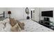 Comfortable bedroom featuring neutral tones and backyard view at 11987 Quarry Ct, Fishers, IN 46037