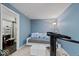 Comfortable bedroom boasts a daybed with decorative pillows, and workout machine with ample natural light at 11987 Quarry Ct, Fishers, IN 46037