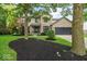 Charming two-story home with a brick and vinyl exterior, black mulch beds, and well-manicured lawn at 11987 Quarry Ct, Fishers, IN 46037