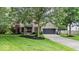 Inviting two-story home with brick accents, a two-car garage, and beautifully landscaped front yard at 11987 Quarry Ct, Fishers, IN 46037