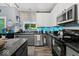 Bright kitchen with stainless appliances, tile backsplash, and ample counter space at 11987 Quarry Ct, Fishers, IN 46037