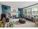 Stylish living room with a fireplace, plush seating, and plenty of natural light creating a cozy space at 11987 Quarry Ct, Fishers, IN 46037