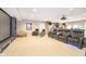 Finished basement with home theater setup, complete with reclining seats and movie screen at 12192 Woods Bay Pl, Carmel, IN 46033