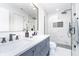 Modern bathroom featuring double vanity and glass enclosed shower at 12192 Woods Bay Pl, Carmel, IN 46033