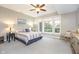 Bright bedroom featuring natural light, a ceiling fan, and neutral decor at 12192 Woods Bay Pl, Carmel, IN 46033