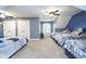 Large bedroom featuring multiple beds and abundant sleeping arrangements at 12192 Woods Bay Pl, Carmel, IN 46033
