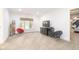 Spacious room features large window, TV, carpeted floor, and neutral paint color at 12192 Woods Bay Pl, Carmel, IN 46033