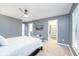 Well-lit bedroom with neutral decor and an ensuite bathroom at 12192 Woods Bay Pl, Carmel, IN 46033