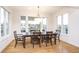 Bright dining room with water views and modern chandelier at 12192 Woods Bay Pl, Carmel, IN 46033