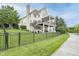 Beautiful brick home with a spacious deck, stairs, and well-maintained lawn at 12192 Woods Bay Pl, Carmel, IN 46033