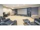 Cozy home theater with comfortable seating and a large screen for immersive viewing at 12192 Woods Bay Pl, Carmel, IN 46033