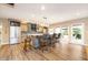 Well-appointed kitchen featuring a large central island, breakfast bar, and stainless steel appliances at 12192 Woods Bay Pl, Carmel, IN 46033