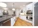 Updated kitchen featuring stainless steel appliances and a granite island at 12192 Woods Bay Pl, Carmel, IN 46033