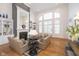 Grand living room offers soaring ceilings, large windows, fireplace and comfortable seating for relaxation and entertaining at 12192 Woods Bay Pl, Carmel, IN 46033