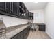 Office space features a desk, cabinets, and granite countertops, perfect for a home workspace at 12192 Woods Bay Pl, Carmel, IN 46033