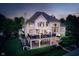 Expansive two-level outdoor living space with covered seating, dining, and entertainment areas at 12192 Woods Bay Pl, Carmel, IN 46033