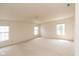 Expansive carpeted bedroom offers natural light from three windows and includes a ceiling fan at 12671 Endurance Dr, Fishers, IN 46037