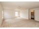 Large carpeted bedroom with neutral paint and an ensuite bathroom at 12671 Endurance Dr, Fishers, IN 46037
