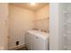 Functional laundry room with side-by-side washer and dryer, and storage shelving at 12671 Endurance Dr, Fishers, IN 46037