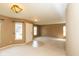 A cozy living room featuring neutral walls, carpet flooring and lots of natural light at 12671 Endurance Dr, Fishers, IN 46037