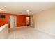 Carpeted loft area with painted accent wall and views to the bathroom at 12671 Endurance Dr, Fishers, IN 46037