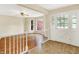 Bright foyer with hardwood floors, a ceiling fan, and a view into the front bay window at 13172 E 116Th St, Fishers, IN 46037