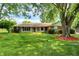 Charming ranch home with a well-maintained lawn and beautiful mature trees at 13172 E 116Th St, Fishers, IN 46037