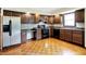 A kitchen with wooden cabinets, laminated countertops and stainless steel refrigerator at 13172 E 116Th St, Fishers, IN 46037