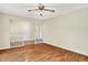 Open living area with hardwood floors, neutral walls, and a partial view to another room at 13172 E 116Th St, Fishers, IN 46037