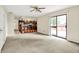 Open-concept living area with access to a deck and a view of the kitchen's breakfast bar at 13172 E 116Th St, Fishers, IN 46037