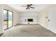Living space with view of the fireplace, carpeting, and sliding glass doors leading to outdoor space at 13172 E 116Th St, Fishers, IN 46037