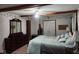 Tranquil bedroom featuring a decorative wall design, a four-poster bed and ample closet space at 1322 Greenway Dr, Anderson, IN 46011