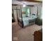 Charming bedroom with a four-poster bed, and ample closet space with floral decorated walls at 1322 Greenway Dr, Anderson, IN 46011
