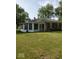 Charming house with an enclosed patio and a well-maintained yard at 1322 Greenway Dr, Anderson, IN 46011