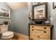 Charming powder room featuring an ornate mirror, vessel sink, and decorative cabinet at 140 4Th Nw St, Carmel, IN 46032