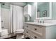 Freshly renovated bathroom featuring a shower and tub combination, a modern sink, and bright lighting at 140 4Th Nw St, Carmel, IN 46032